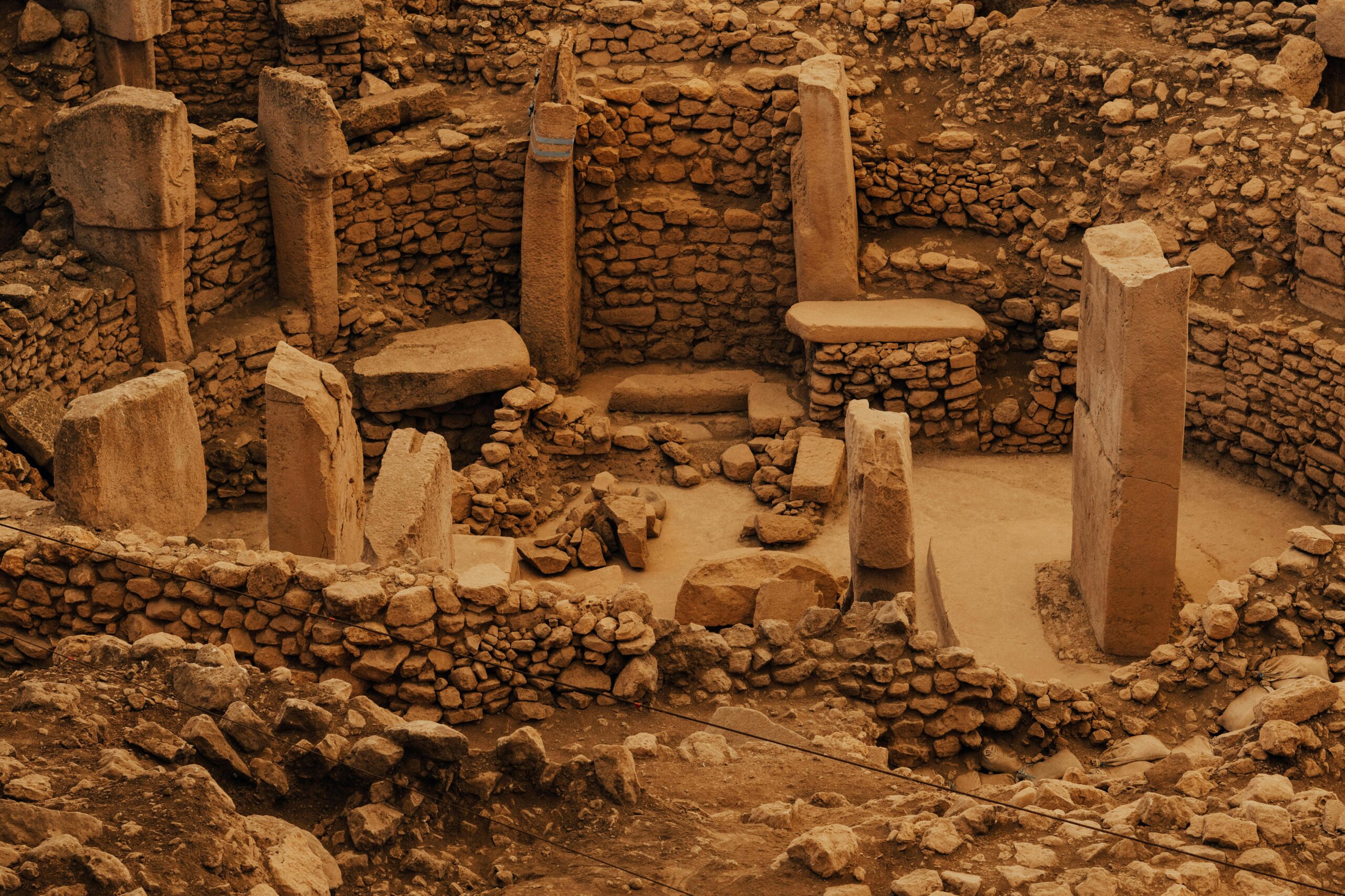 Explore Göbekli Tepe's ancient stone structures in Şanlıurfa, Turkey.